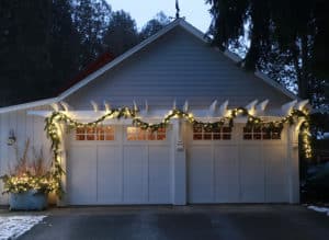 Garage pergola lit up for the holidays