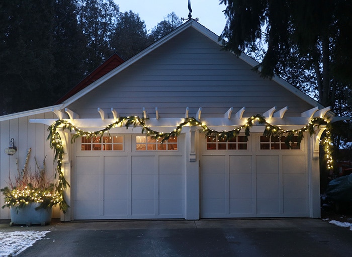 Garage pergola lit up for the holidays