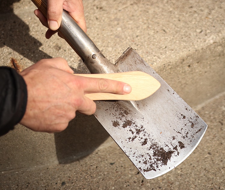 Clean tools with a metal-bristle brush