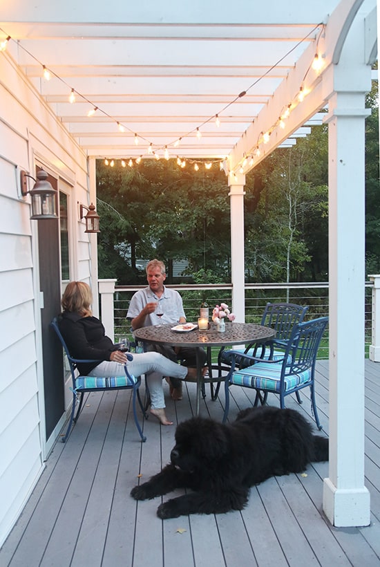 Cafe lights add warmth to any outdoor seating area.