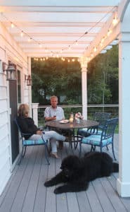 Strings of cafe lights cozy up an outdoor space.