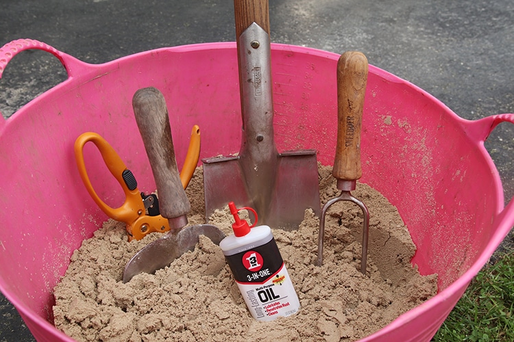 Add a little 3-in-ONE Multipurpose oil to clean sand to store and protect  your garden tools. 