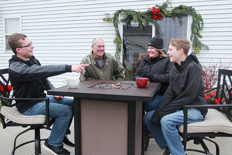 Family enjoys fire table