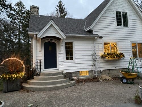 House with winter container displays lit up