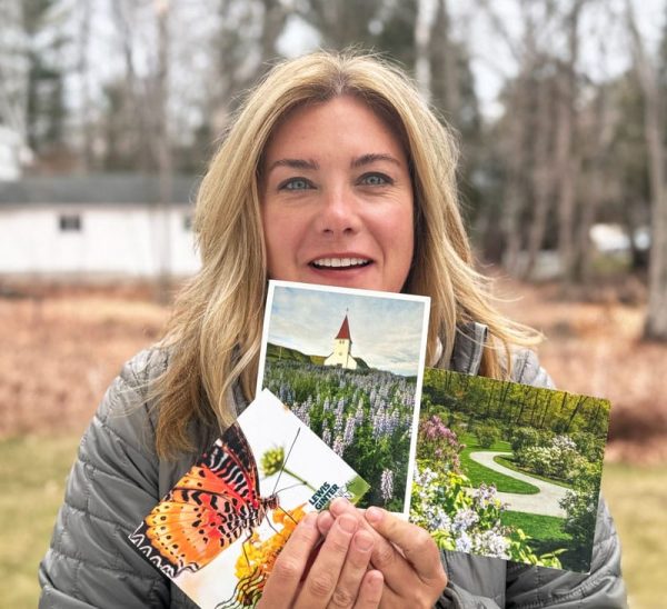 Gardener holding postcards